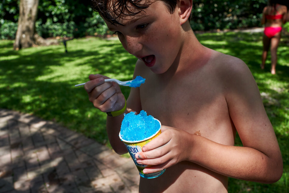 boy eating blue ice cream